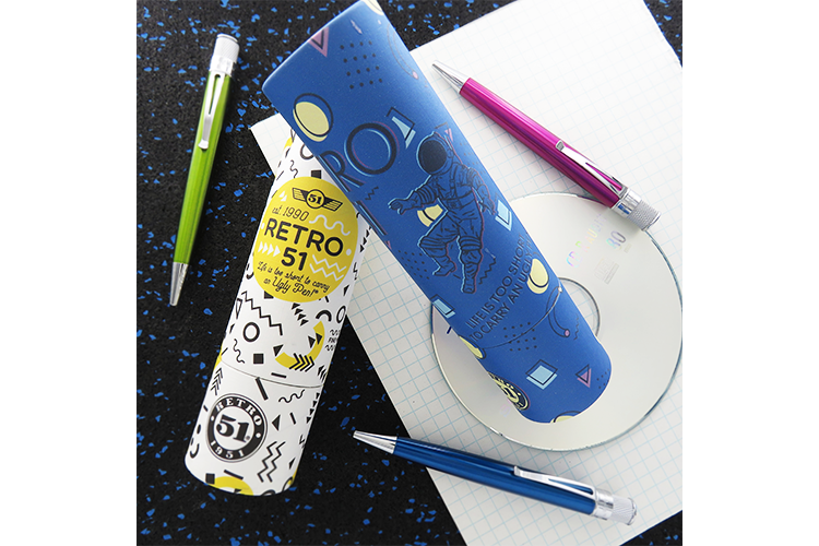 New Retro51 branded graphic tubes and 3 classic laqcuer pens in a retro-style setting 
