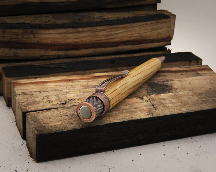 Tornado™ Woodworks - Bourbon Barrel Rollerball on blocks of wood