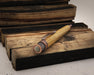 Tornado™ Woodworks - Bourbon Barrel Rollerball on blocks of wood