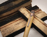 Tornado™ Woodworks - Bourbon Barrel Rollerball resting on woods blocks close up